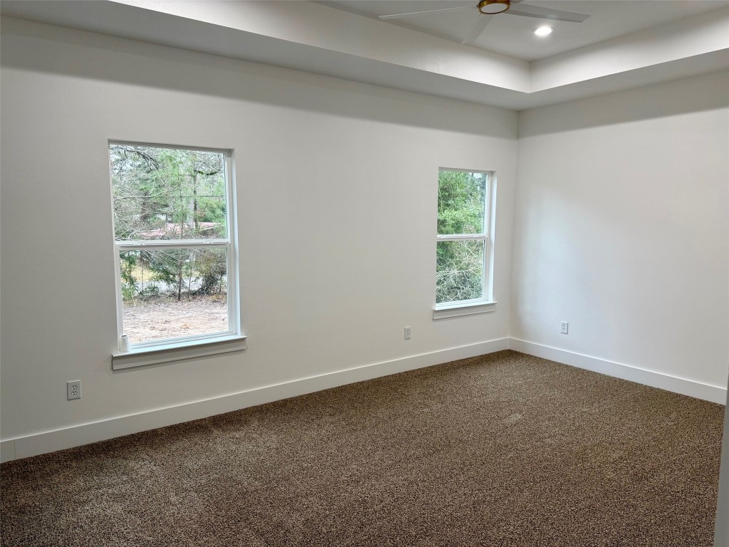 410 Coast Loop Trinity, TX 75862 - Photo 18 of 30 an empty room with windows