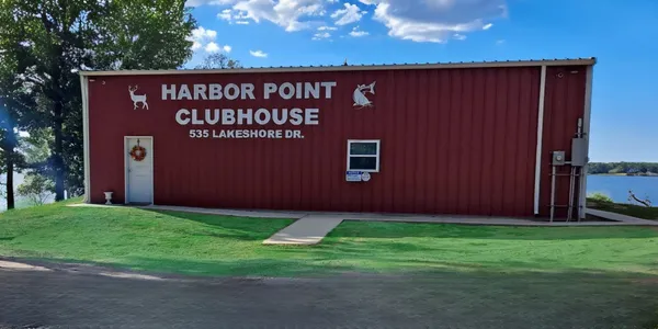 a view of a golf course with chairs