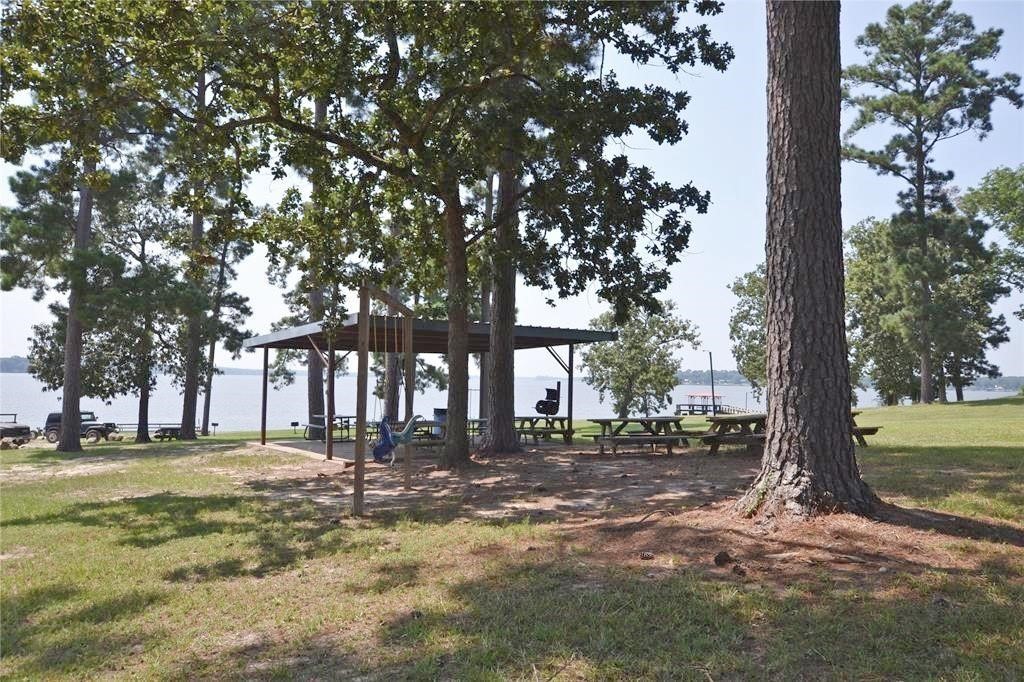 410 Coast Loop Trinity, TX 75862 - Photo 27 of 30 a building with trees in front of it
