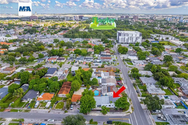 an aerial view of residential building and parking space