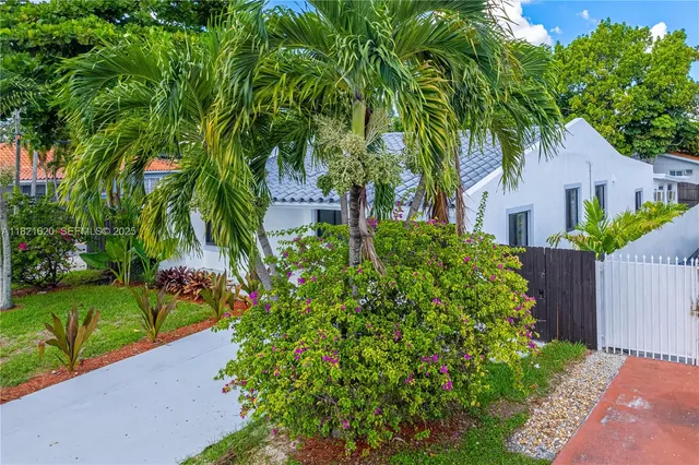 front view of a house with a garden