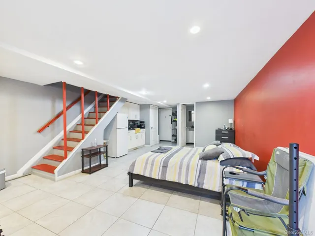 a bedroom with bed and cabinets