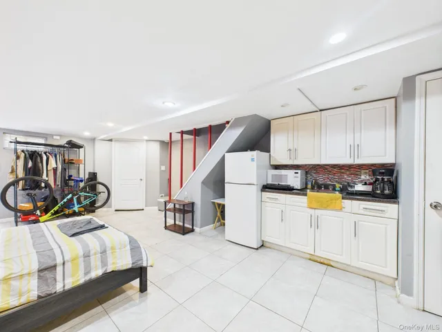 a bed room with a bed and a chair