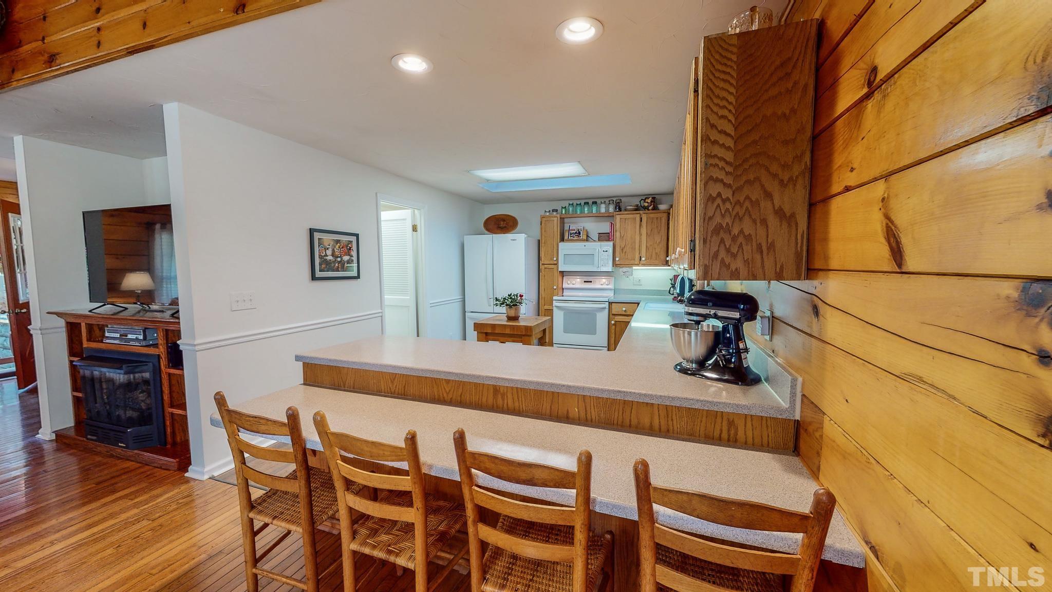 714 Lucy Garrett Road Roxboro, NC 27574 - Photo 11 of 68 a dining room with furniture and wooden floor