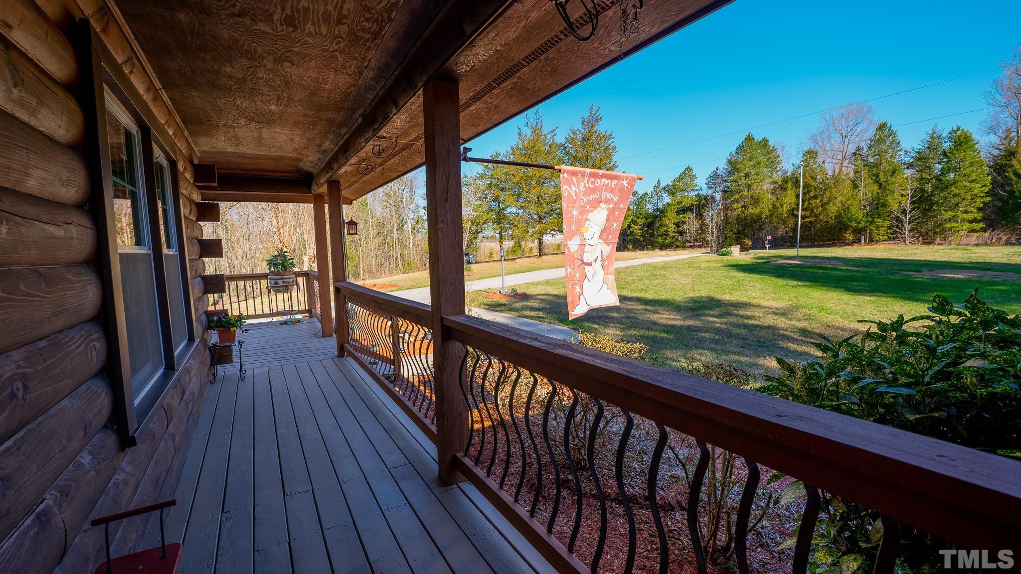 714 Lucy Garrett Road Roxboro, NC 27574 - Photo 15 of 68 a view of balcony with wooden floor and outdoor space