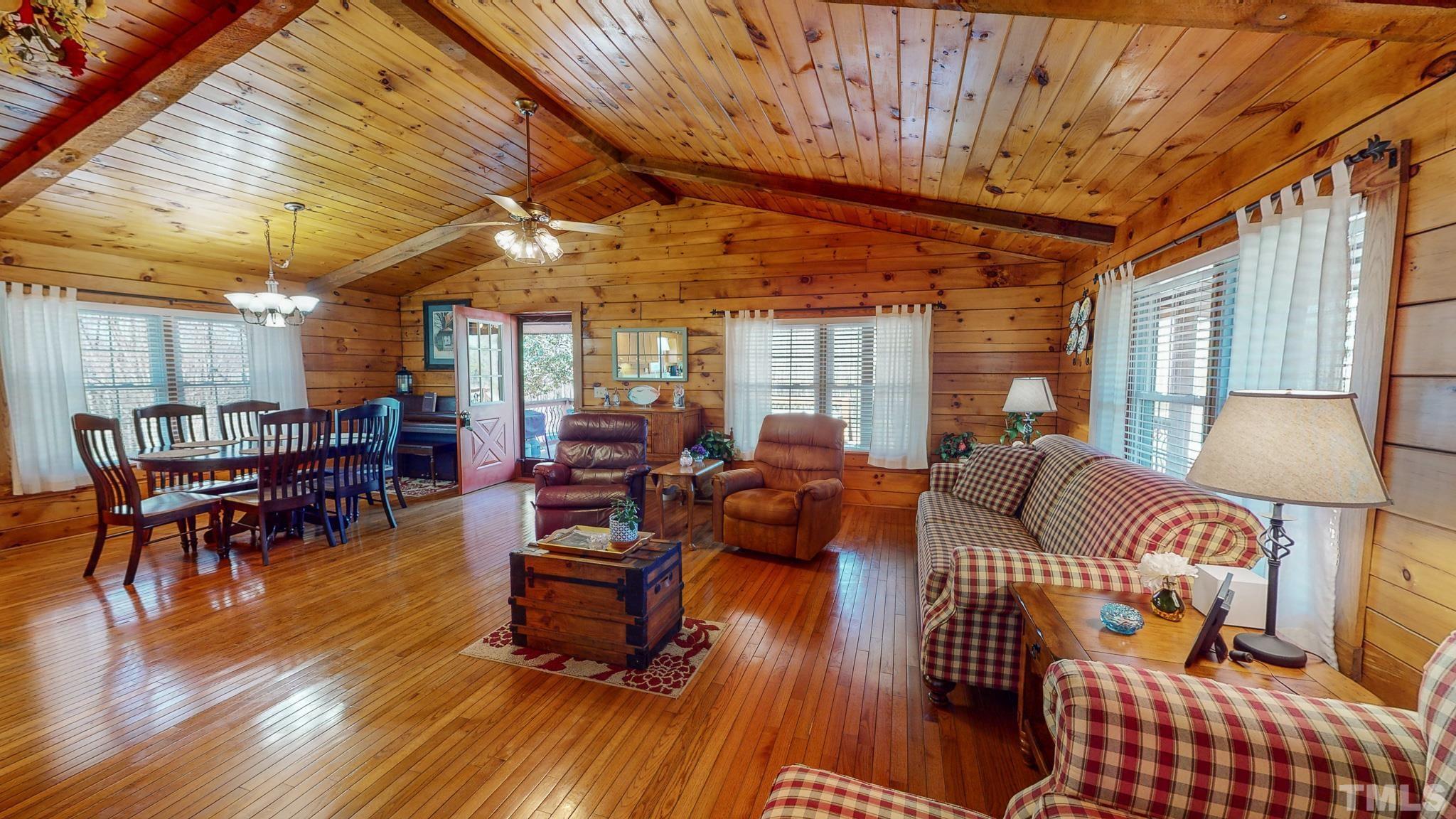 714 Lucy Garrett Road Roxboro, NC 27574 - Photo 2 of 68 a living room with furniture and wooden floors