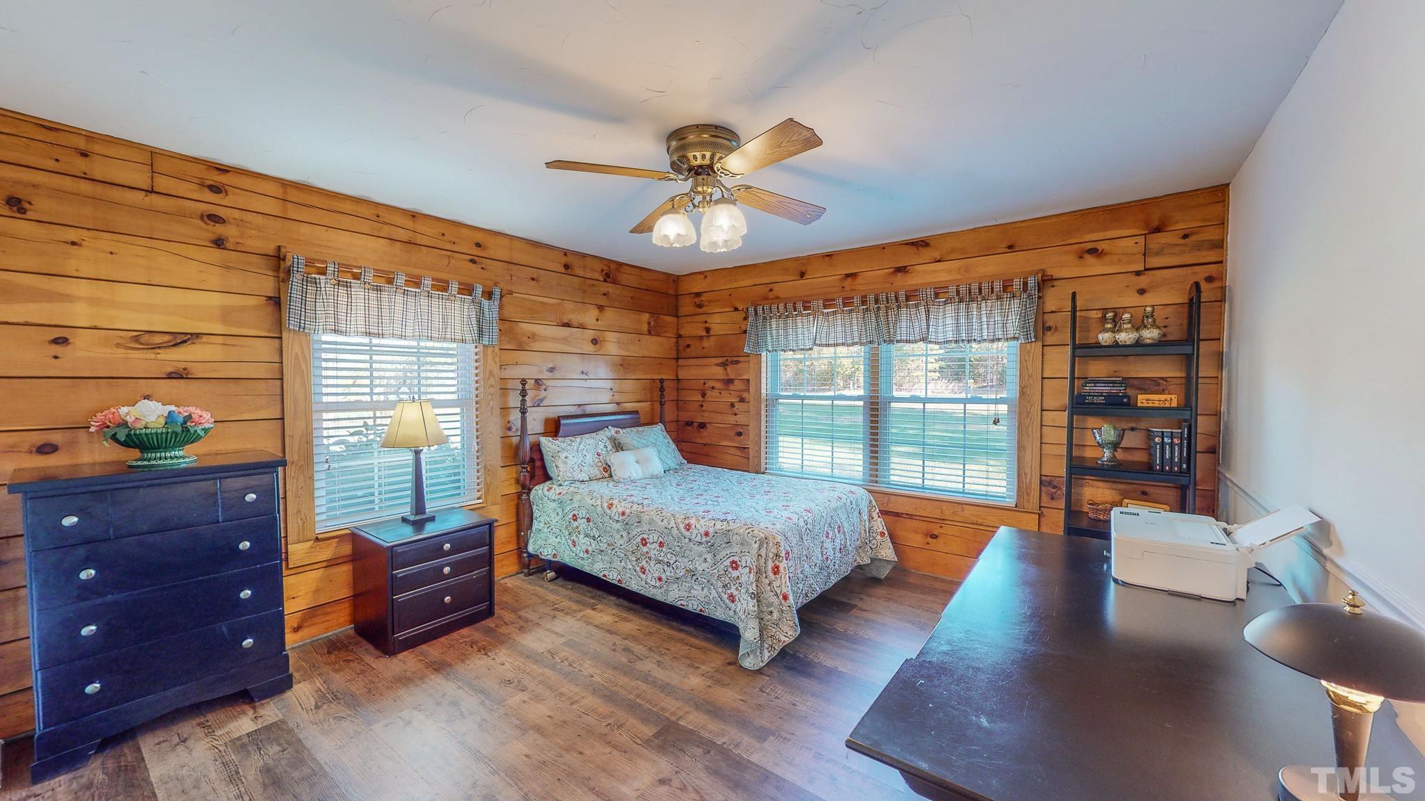 714 Lucy Garrett Road Roxboro, NC 27574 - Photo 25 of 68 a bedroom with a bed and large window