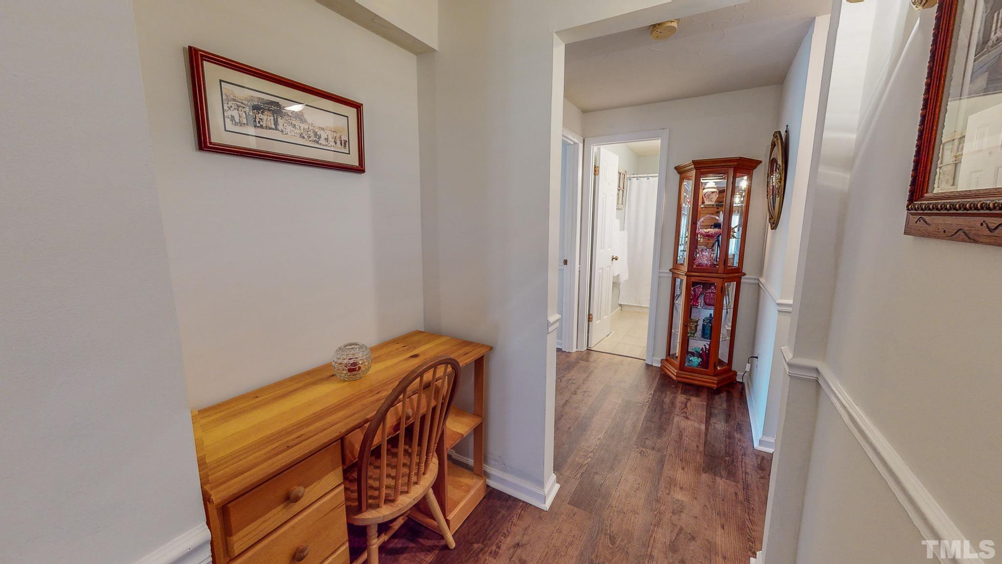 714 Lucy Garrett Road Roxboro, NC 27574 - Photo 30 of 68 a view of a hallway with wooden floor and closet