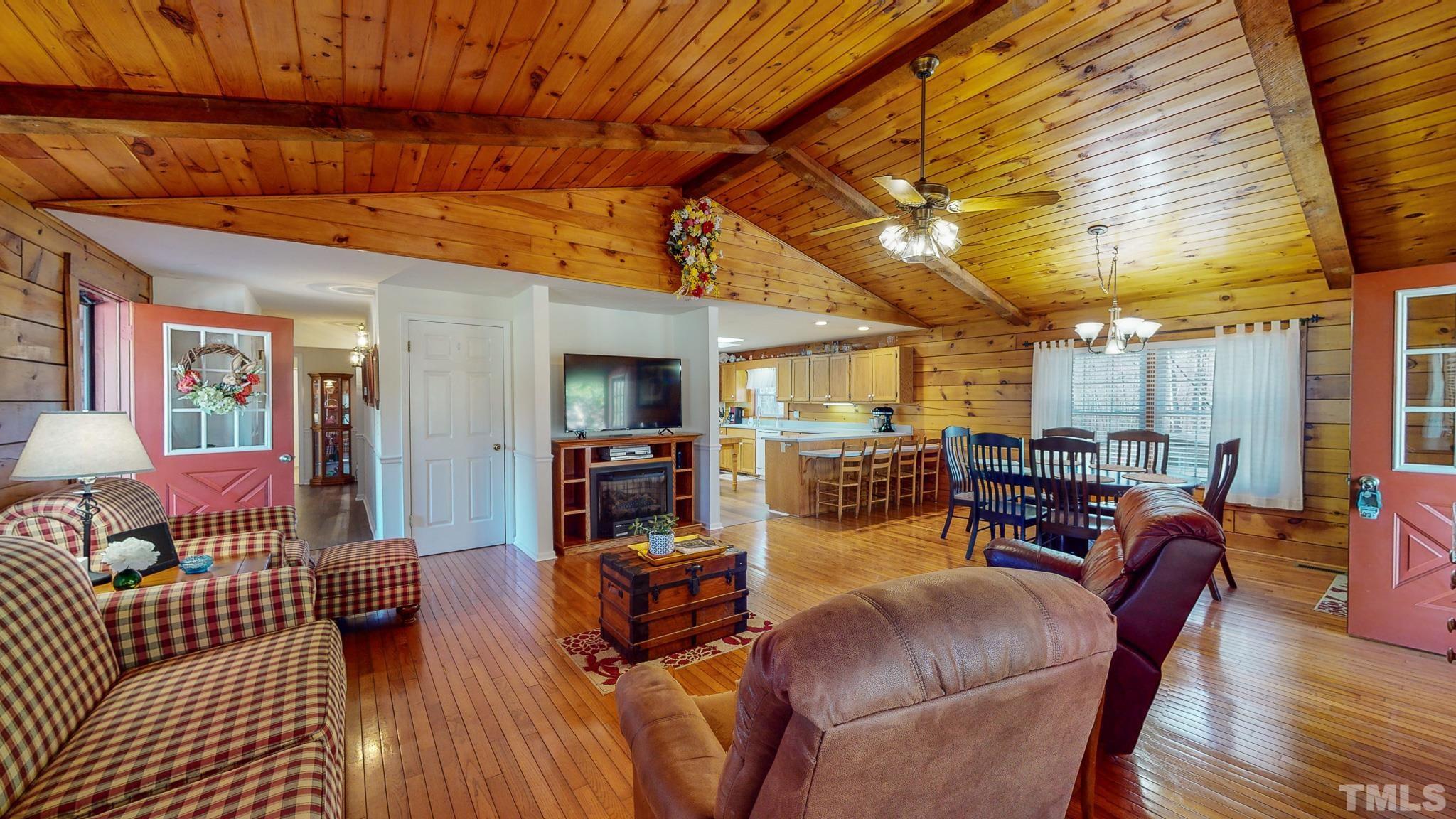 714 Lucy Garrett Road Roxboro, NC 27574 - Photo 3 of 68 a living room with furniture a wooden floor and next to a window