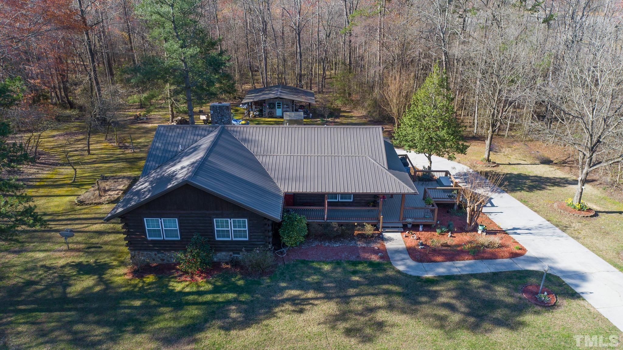 714 Lucy Garrett Road Roxboro, NC 27574 - Photo 31 of 68 a view of a house with a yard