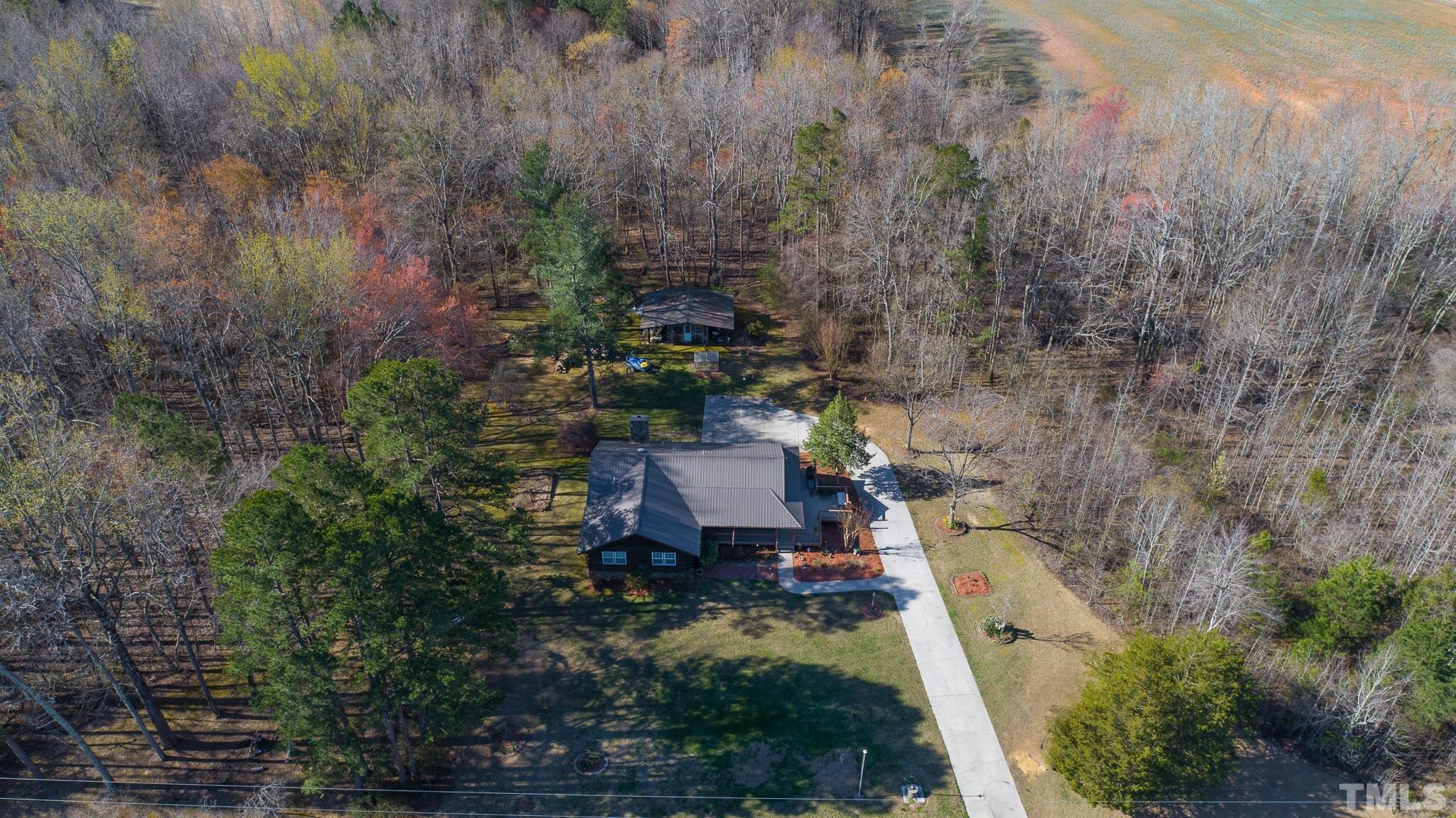 714 Lucy Garrett Road Roxboro, NC 27574 - Photo 53 of 68 an aerial view of a house with a yard