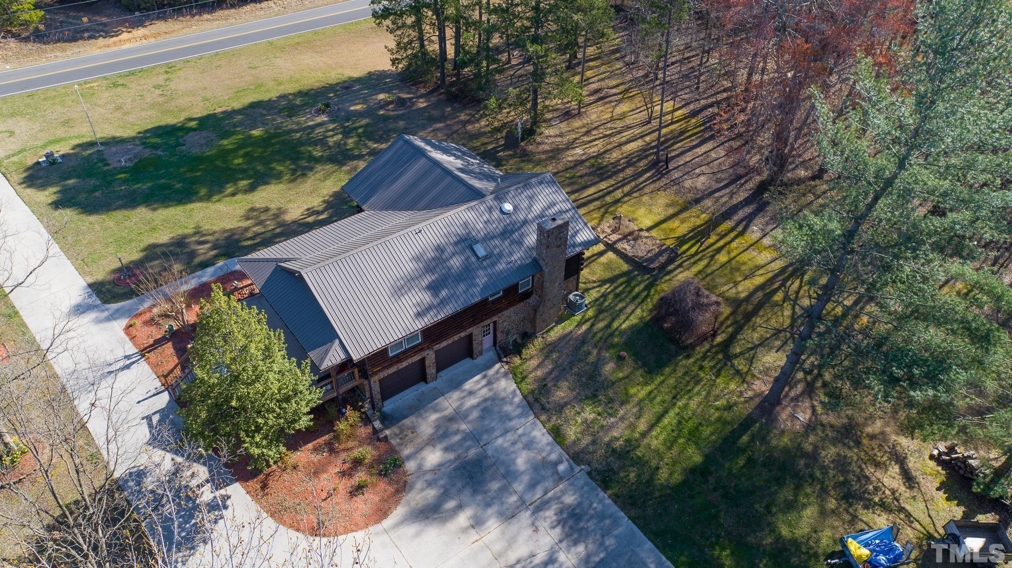 714 Lucy Garrett Road Roxboro, NC 27574 - Photo 56 of 68 a view of a yard with plants