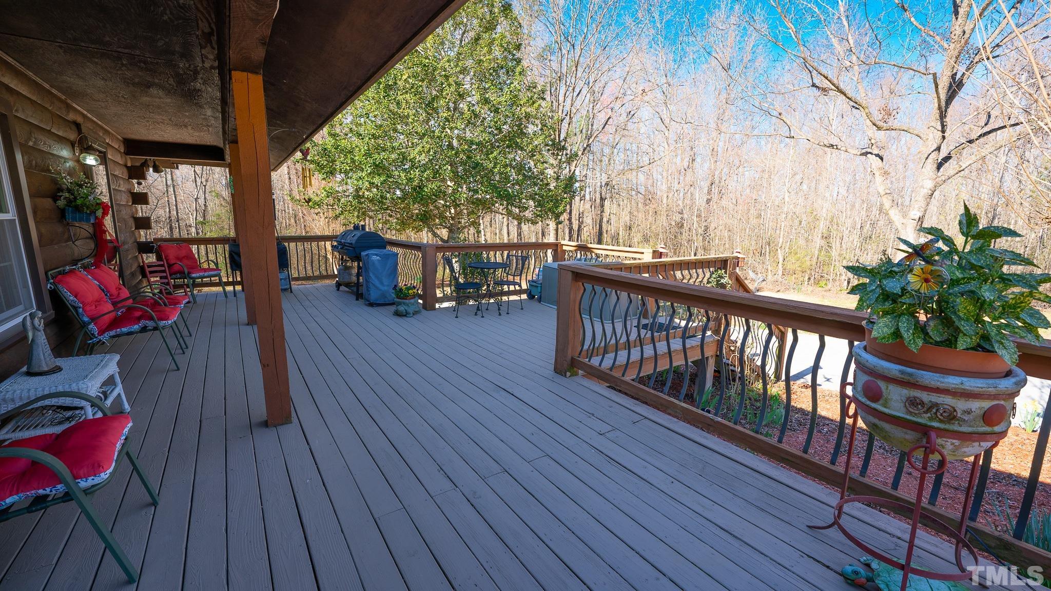 714 Lucy Garrett Road Roxboro, NC 27574 - Photo 6 of 68 a view of balcony with wooden floor and seating space