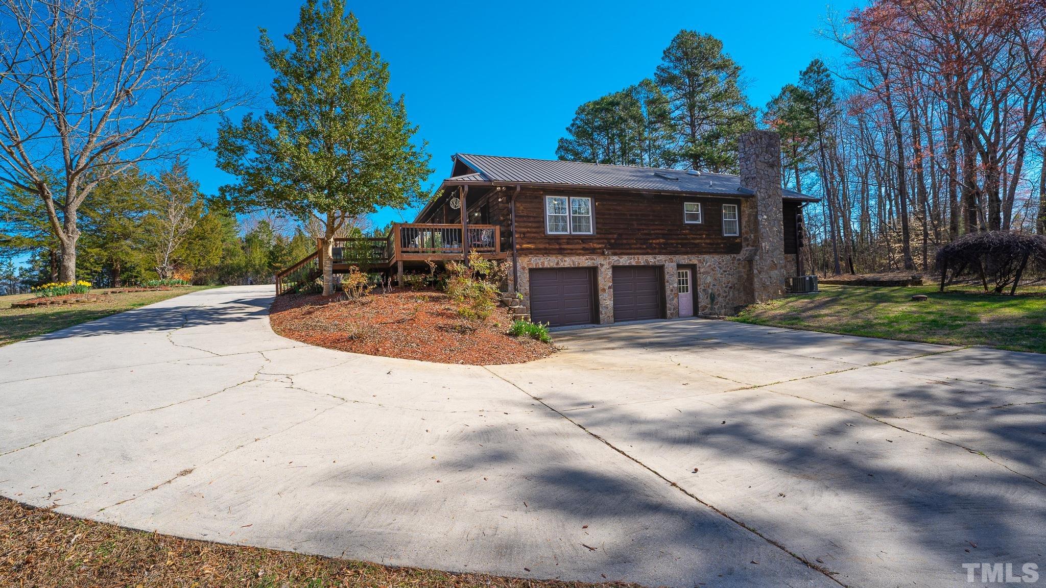 714 Lucy Garrett Road Roxboro, NC 27574 - Photo 7 of 68 a view of a house with a sink and yard