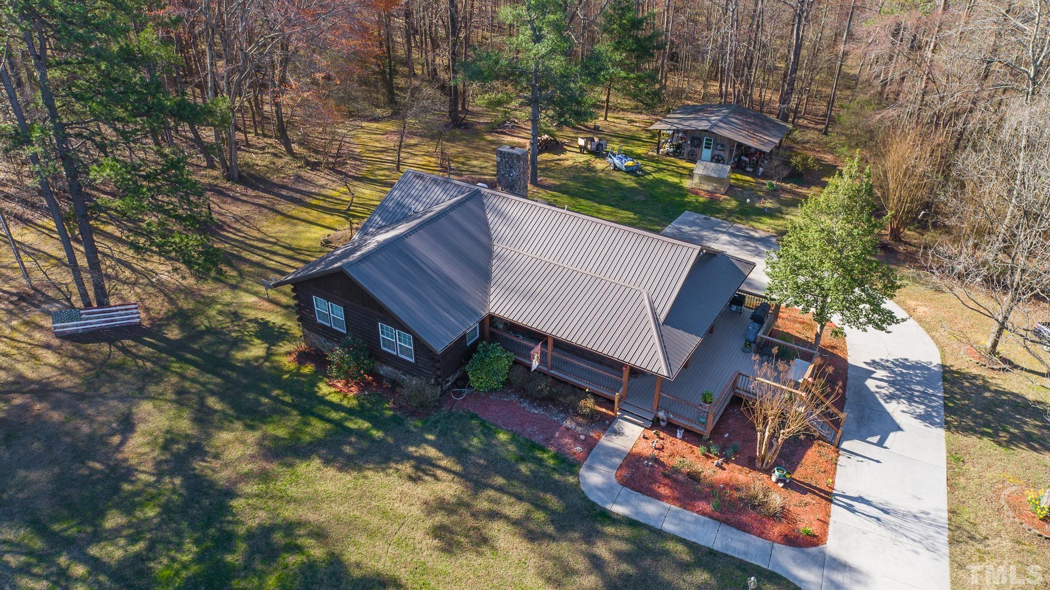 714 Lucy Garrett Road Roxboro, NC 27574 - Photo 8 of 68 a backyard of a house with lots of green space