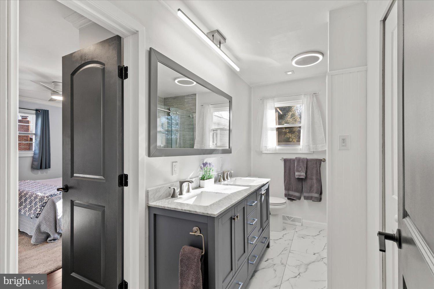 45 Heritage Road Akron, PA 17501 - Photo 13 of 56 a bathroom with a double vanity sink and a mirror