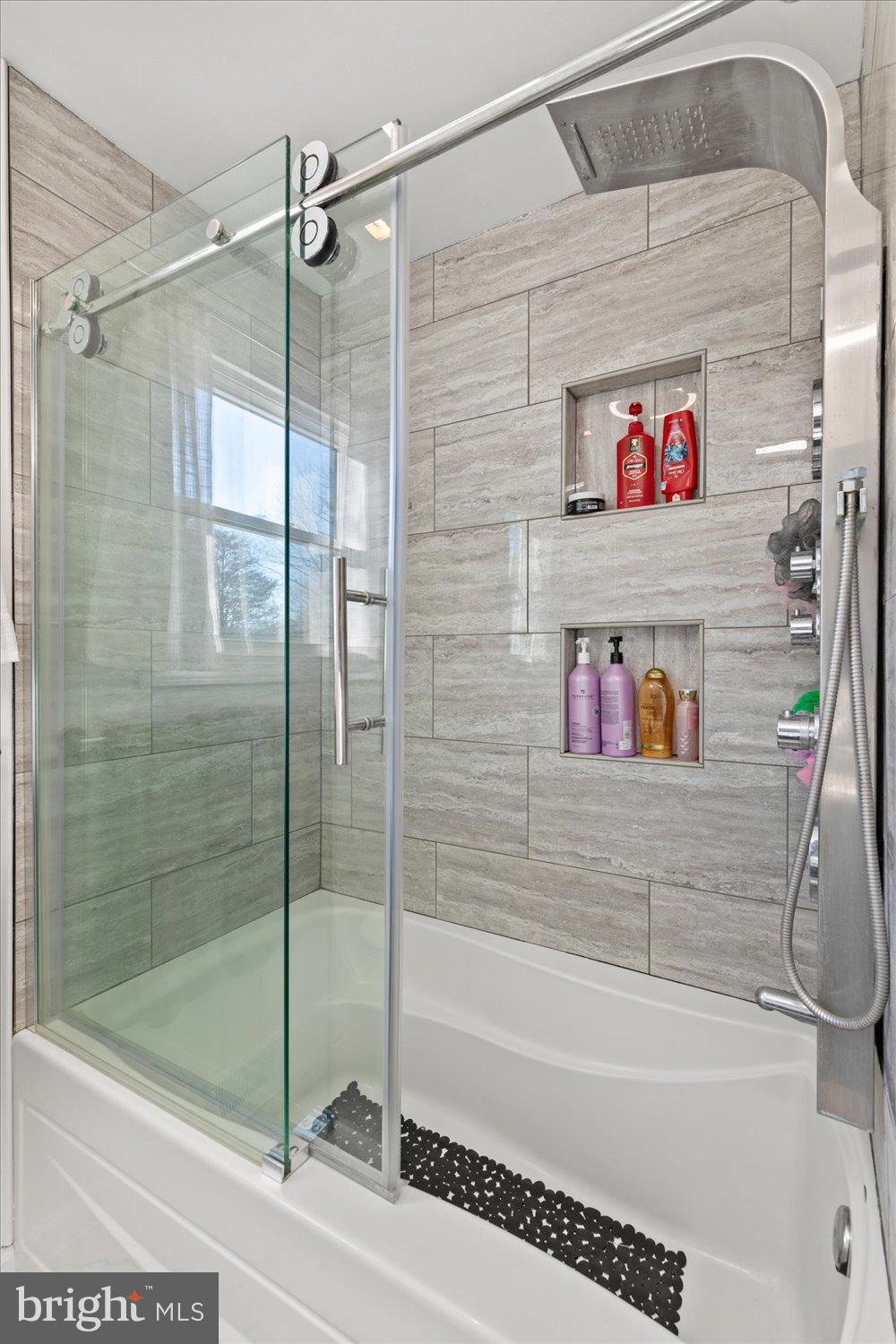 45 Heritage Road Akron, PA 17501 - Photo 15 of 56 a bathroom with a shower and a bath tub
