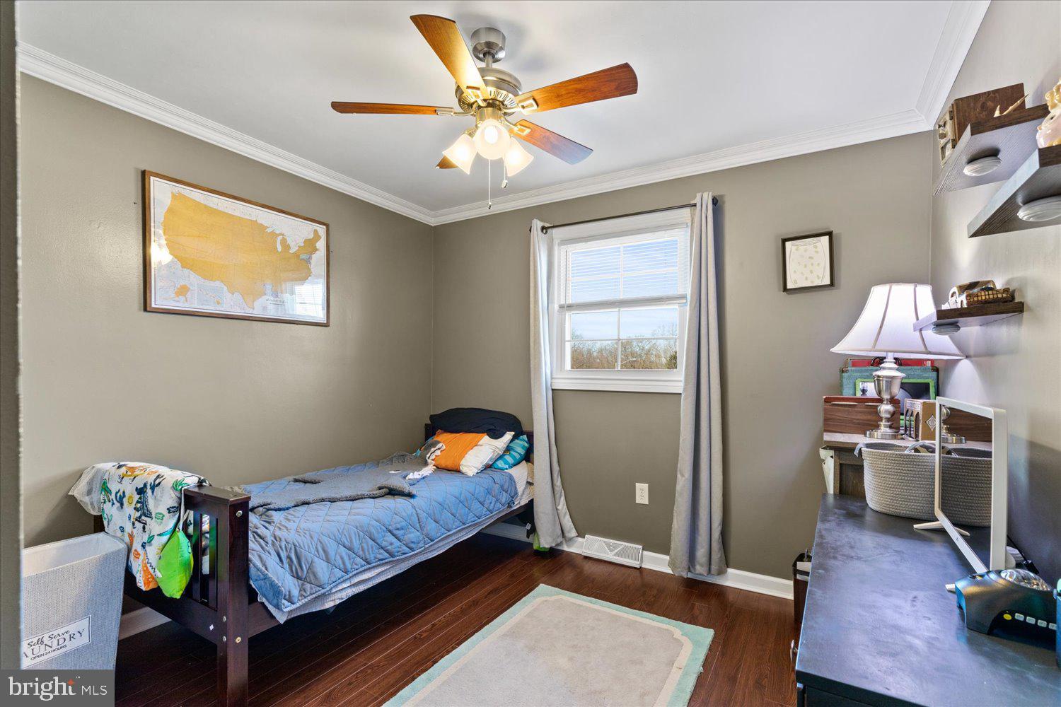 45 Heritage Road Akron, PA 17501 - Photo 20 of 56 a bedroom with a bed and a chandelier