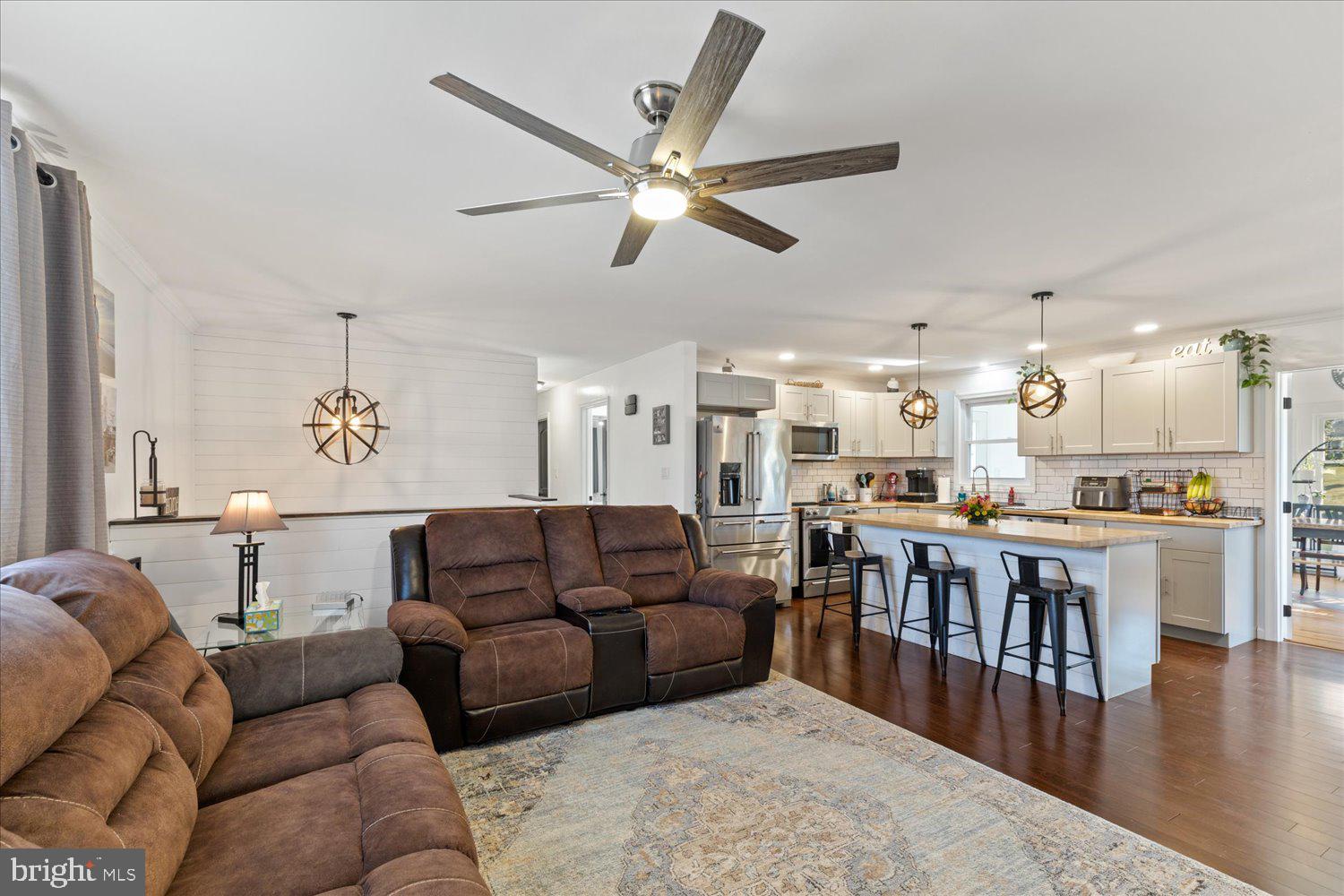 45 Heritage Road Akron, PA 17501 - Photo 3 of 56 a living room with furniture kitchen view and a wooden floor