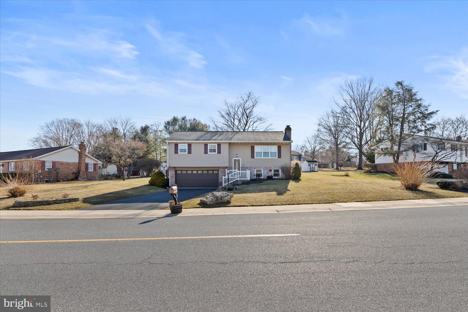 45 Heritage Road Akron, PA 17501 - Photo 53 of 56 a view of a house with a big yard and large trees