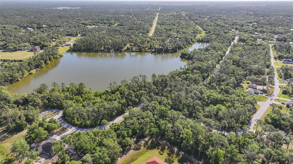 Longwell Ln Port North Port, FL 34286 - Photo 5 of 13 an aerial view of residential houses with outdoor space and lake view
