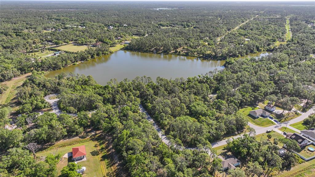 Longwell Ln Port North Port, FL 34286 - Photo 6 of 13 an aerial view of residential building and lake view