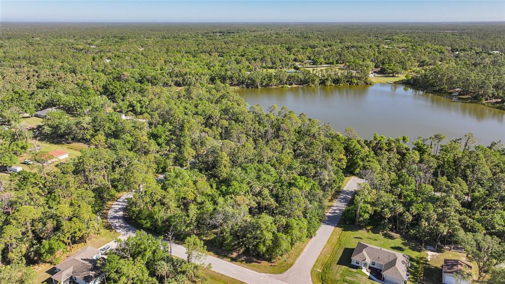 Longwell Ln Port North Port, FL 34286 - Photo 8 of 13 an aerial view of residential houses with outdoor space and lake view