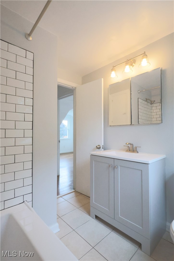1332 South Green Road South Euclid, OH 44121 - Photo 16 of 23 Bathroom with vanity, light tile patterned floors, and bathing tub / shower combination