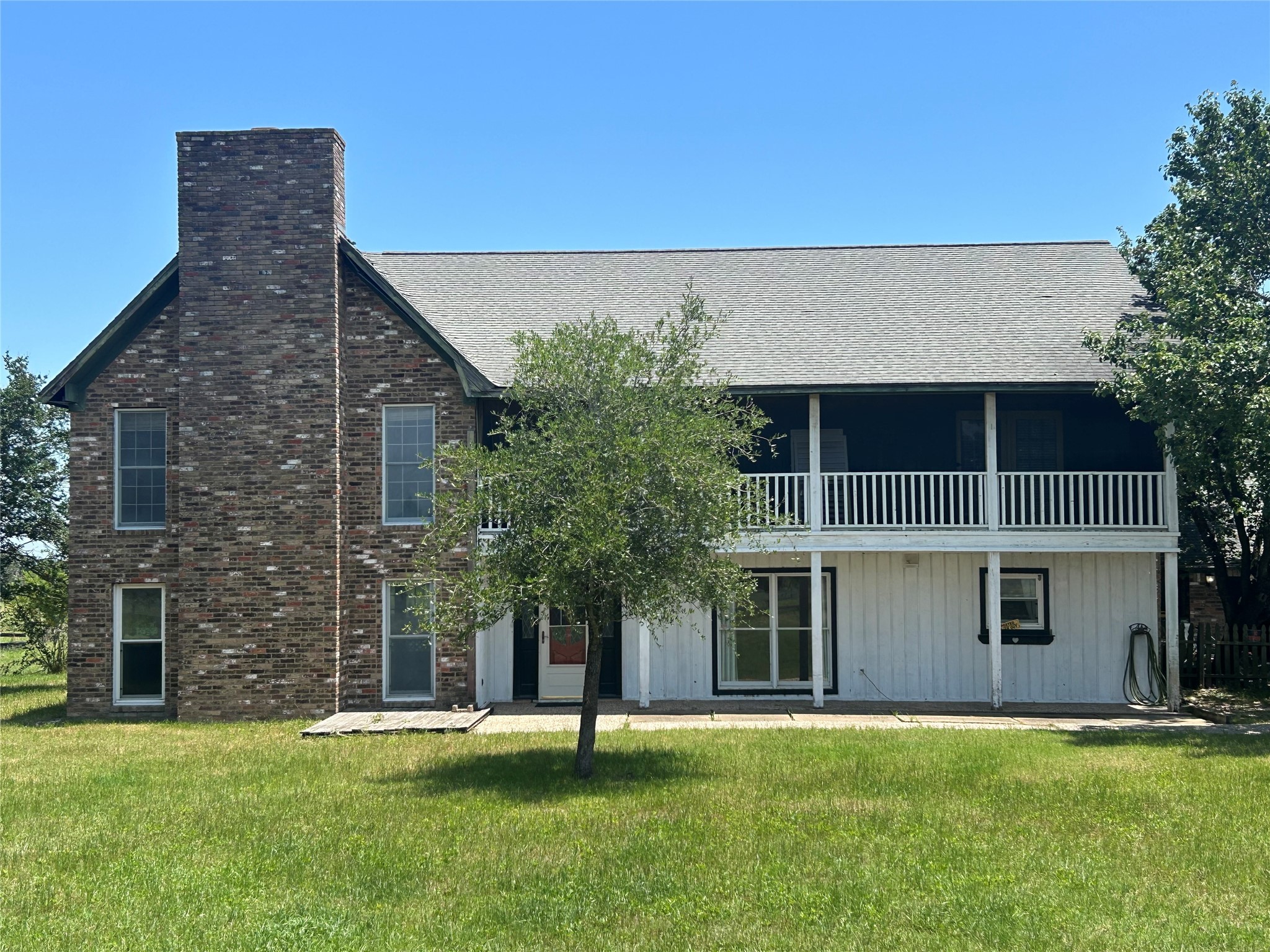 6166 Fm 3060 Midway, TX 75852 - Photo 1 of 14 a front view of a house with a garden