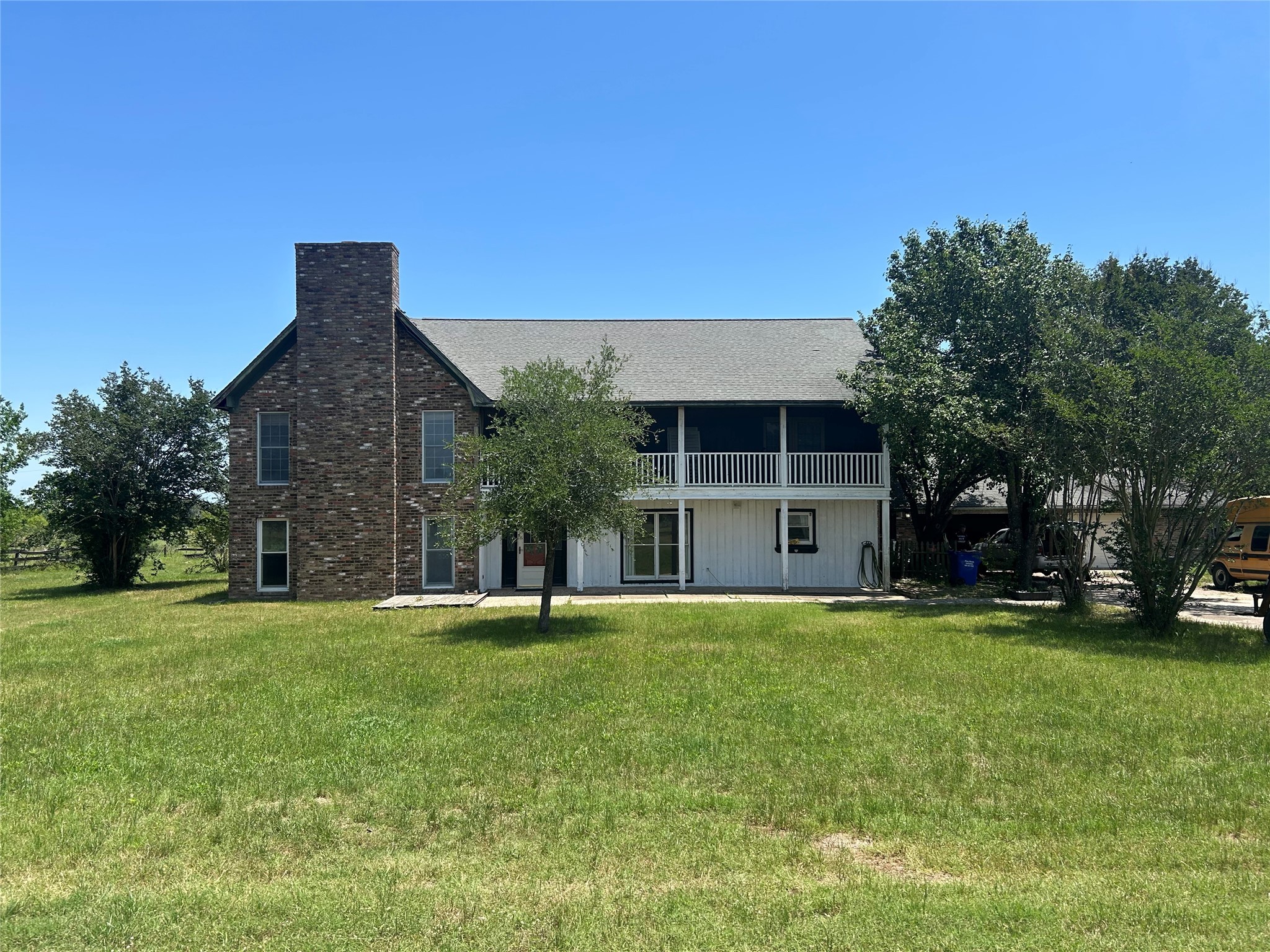 6166 Fm 3060 Midway, TX 75852 - Photo 14 of 14 a front view of a house with a yard and garage