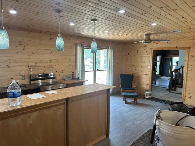 a kitchen with a sink appliances and cabinets