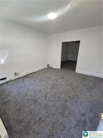 a view of a backyard of the house