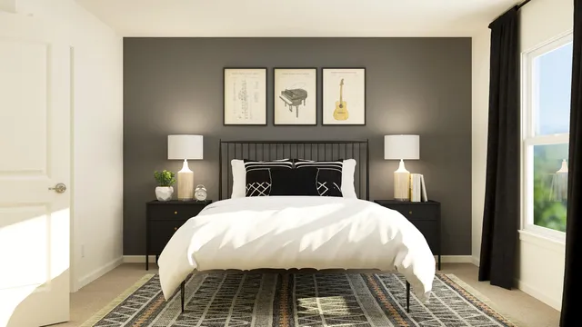 a bed sitting in a bedroom next to a window and a fireplace