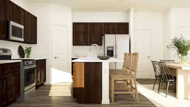 a kitchen with stainless steel appliances a stove refrigerator and microwave