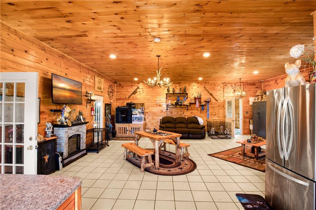 5164 Lincoln Highway Stoystown, PA 15563 - Photo 23 of 50 a room with lots of white furniture and cars