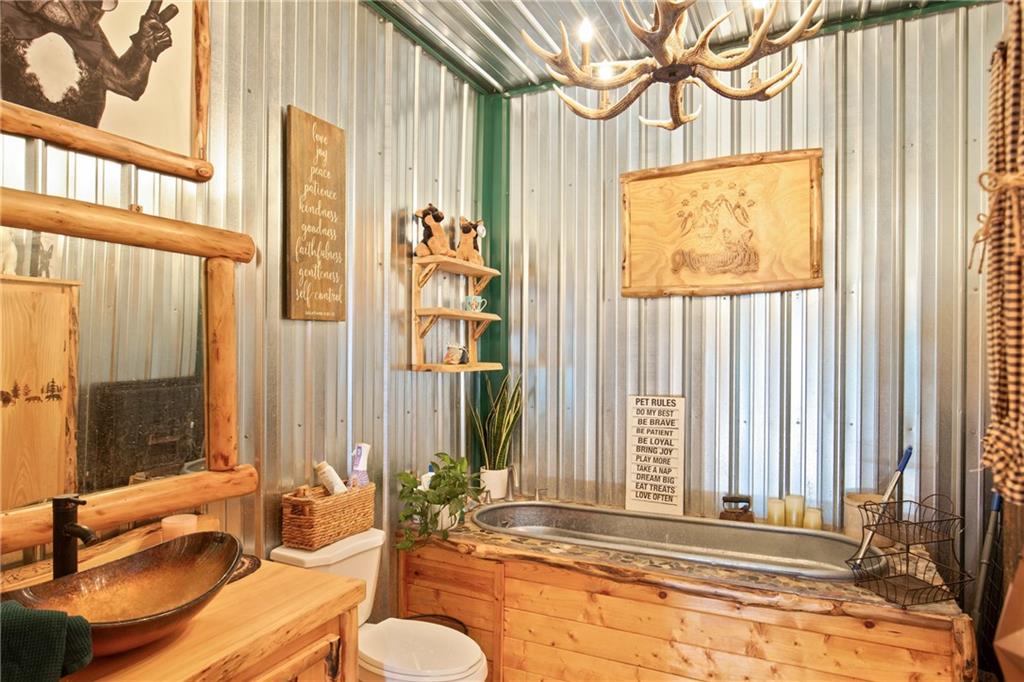 5164 Lincoln Highway Stoystown, PA 15563 - Photo 25 of 50 a bathroom with a tub sink and mirror