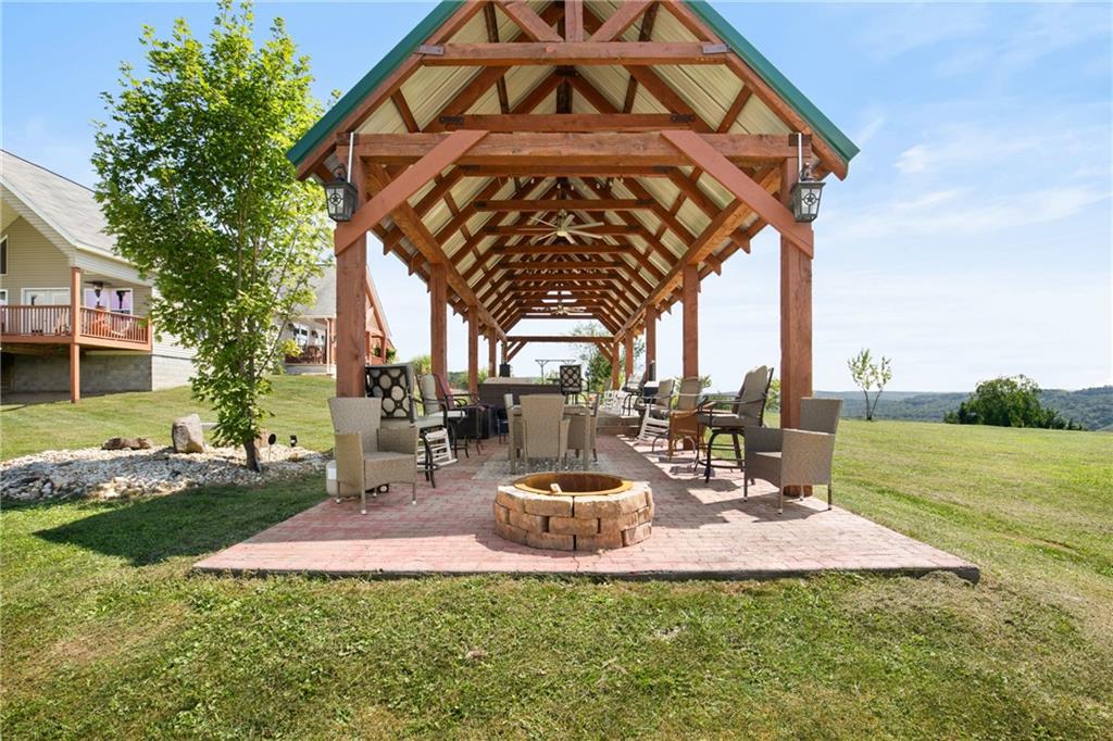 5164 Lincoln Highway Stoystown, PA 15563 - Photo 31 of 50 a view of a swimming pool with a table and chairs