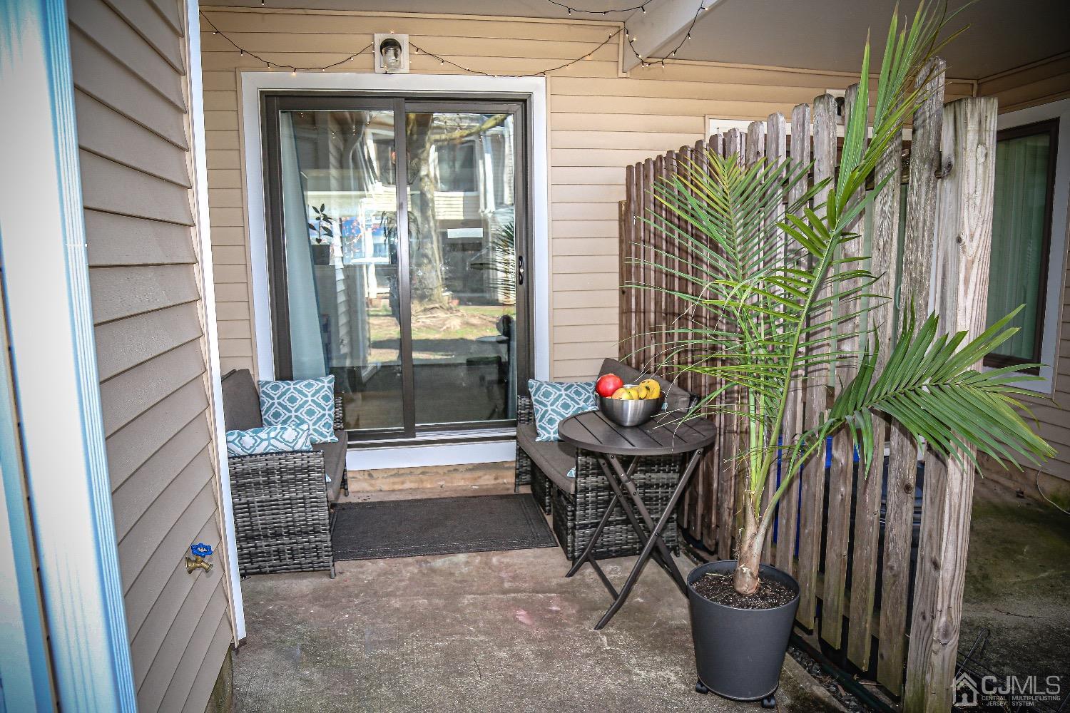 5805 Hana Road Edison, NJ 08817 - Photo 38 of 40 a view of a porch with chairs and a potted plant