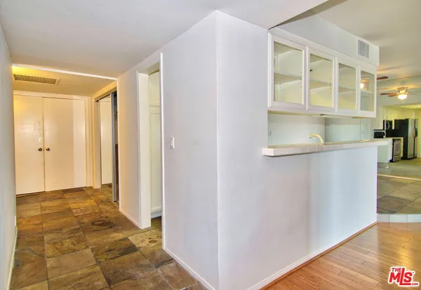 a view of a bathroom with a glass door