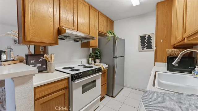 a kitchen with a sink cabinets and appliances