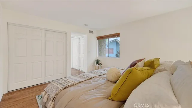 a bathroom with a sink toilet vanity and shower