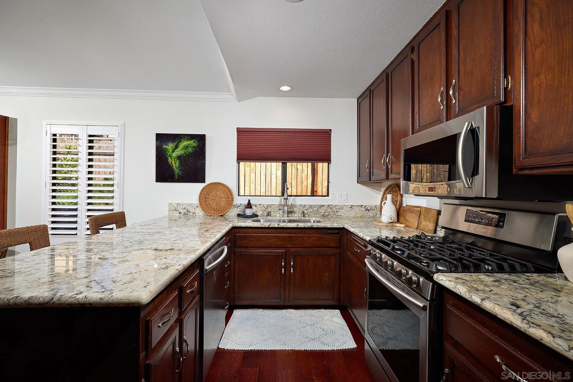 1960 Maverick Glen Escondido, CA 92027 - Photo 21 of 45 a kitchen with granite countertop a stove and a sink