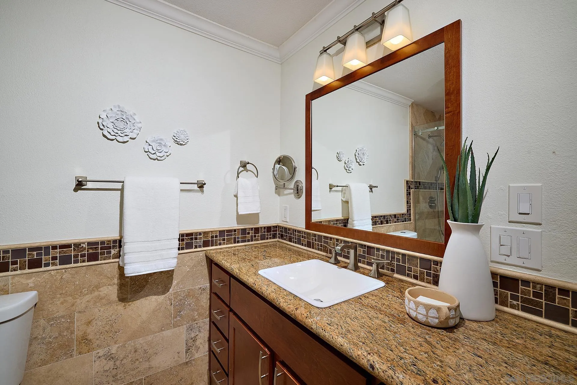 1960 Maverick Glen Escondido, CA 92027 - Photo 25 of 45 a bathroom with a granite countertop sink and a mirror