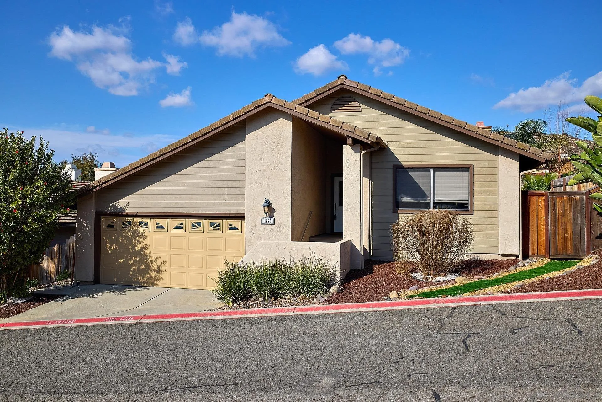 1960 Maverick Glen Escondido, CA 92027 - Photo 9 of 45 a front view of a house with a yard