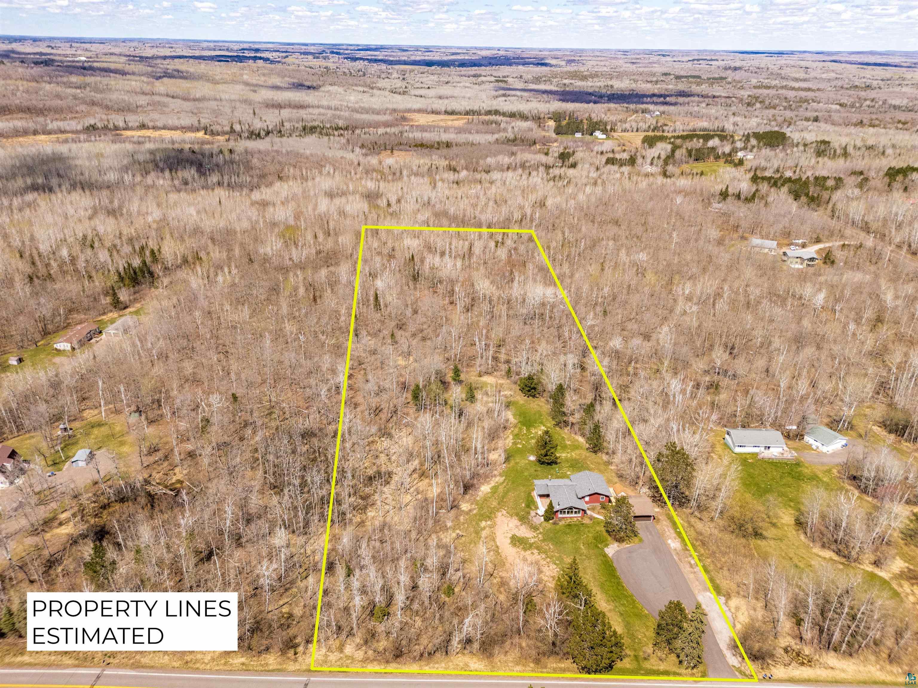 3325 Strand Road Duluth, MN 55803 - Photo 4 of 25 Illustration of expansive undeveloped acreage to the north of property featuring a mix of mature deciduous trees and evergreens.