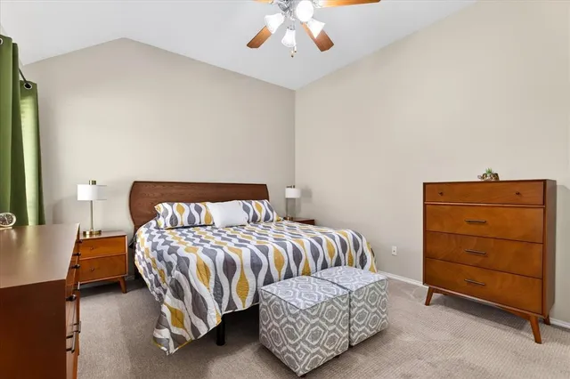 a bedroom with a bed and a dresser