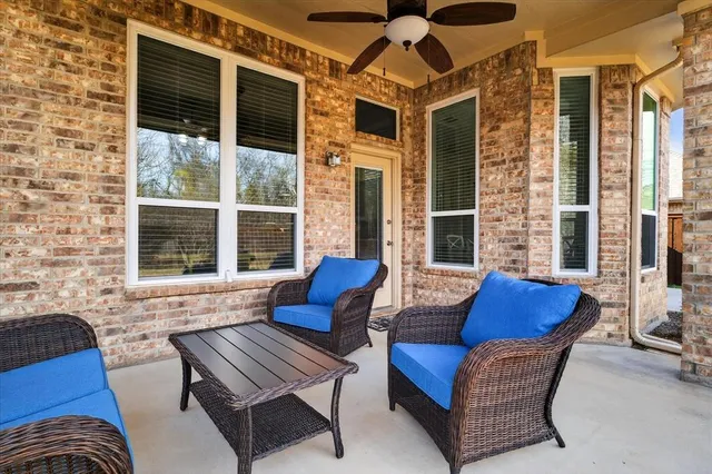 a outdoor living space with furniture and a large window