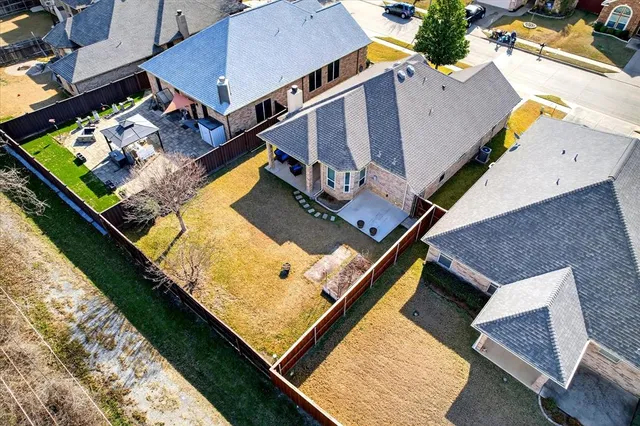 an aerial view of house with pool