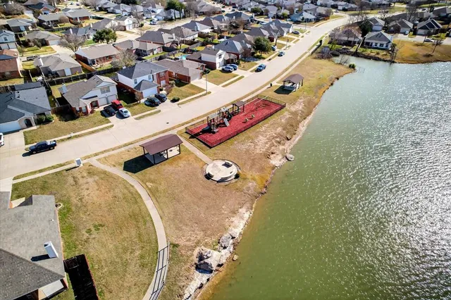 an aerial view of a house with a swimming pool