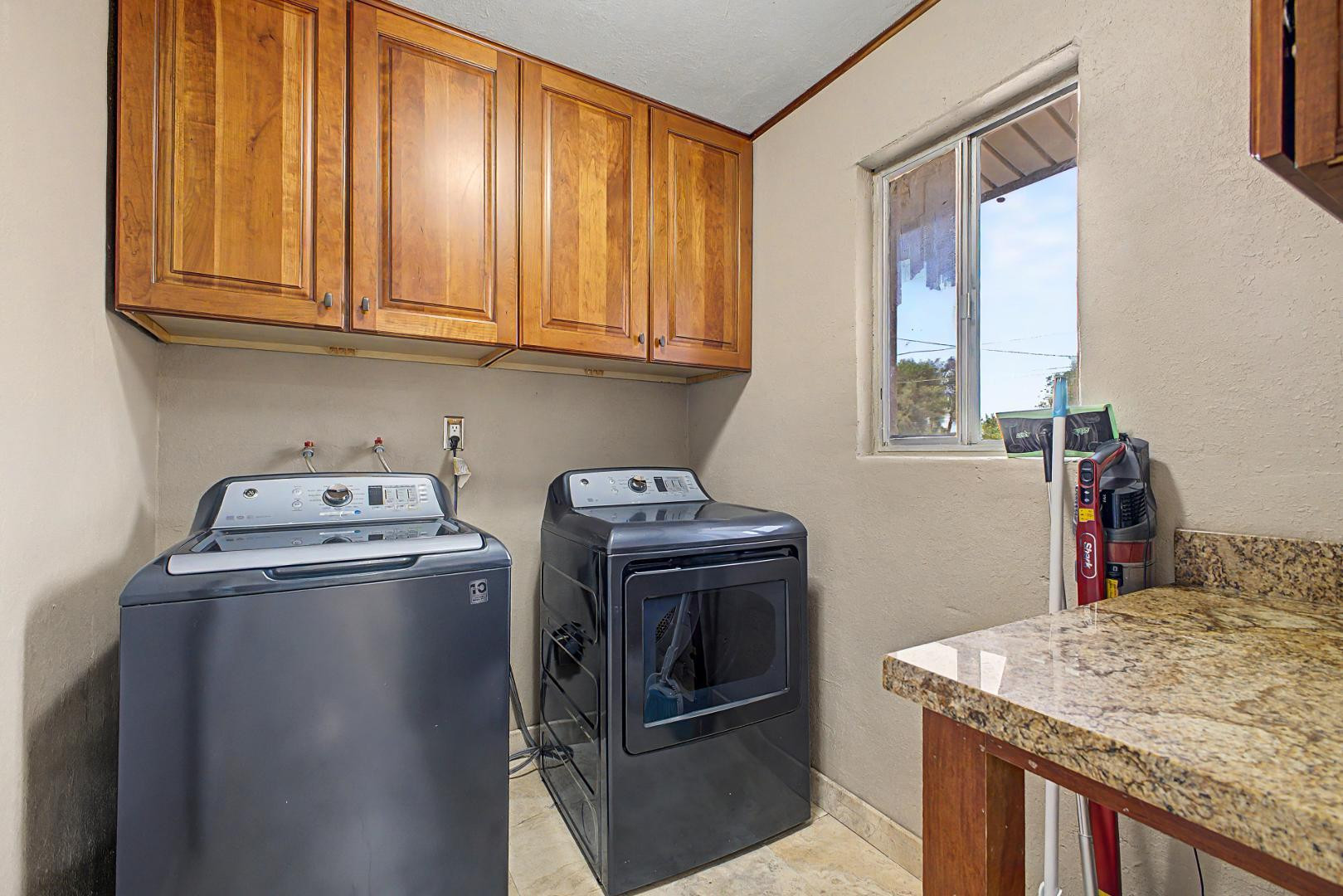 3346 East Cochise Road Phoenix, AZ 85028 - Photo 33 of 40 a kitchen with stainless steel appliances granite countertop a sink stove and refrigerator